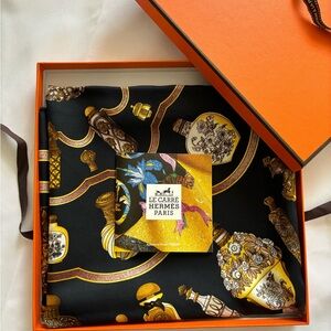 Authentic HERMES black and gold silk “Qu’Importe Le Flacon” scarf - 34”x 34”